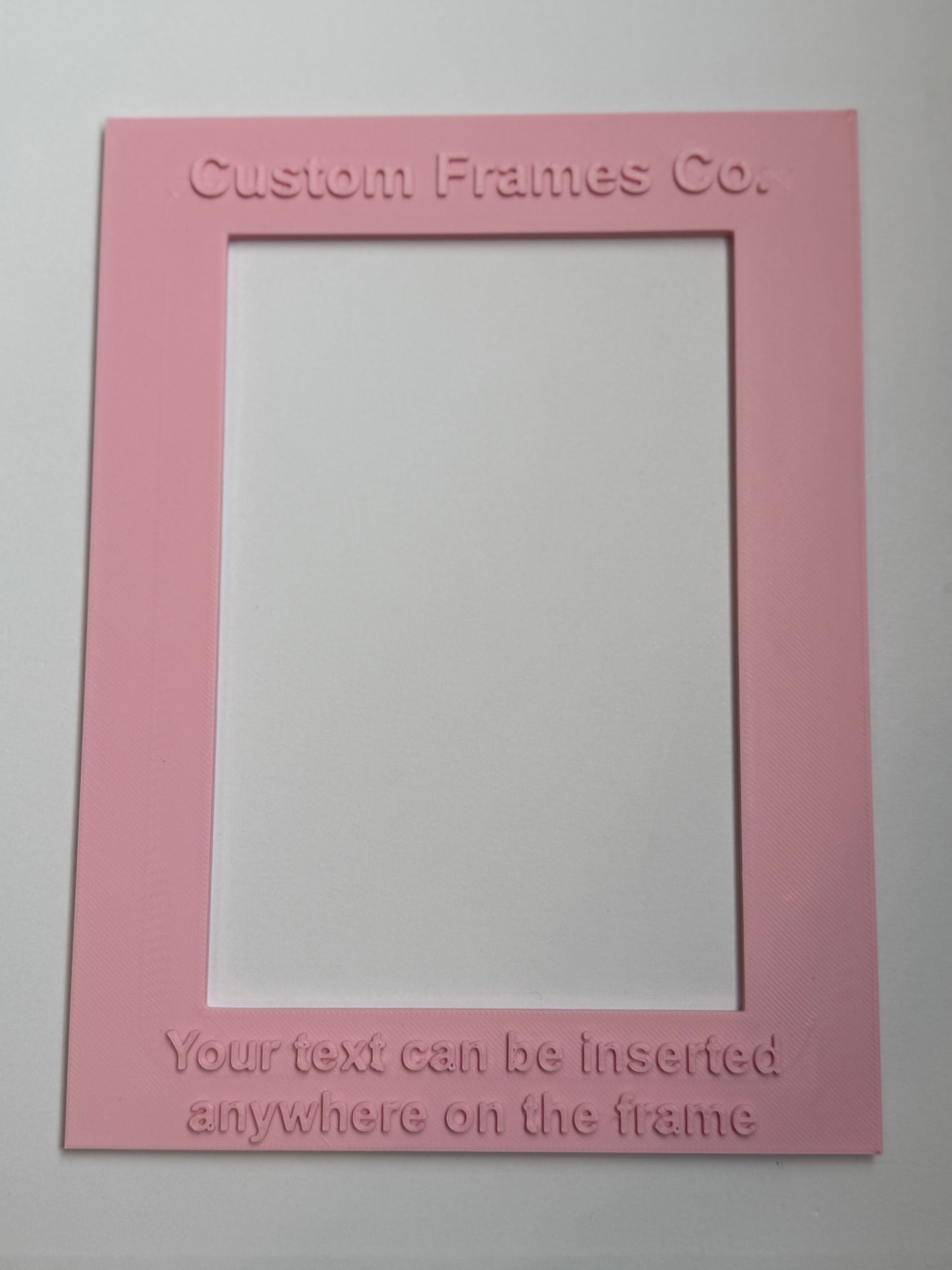 Pink picture frame with text on a white background vetical