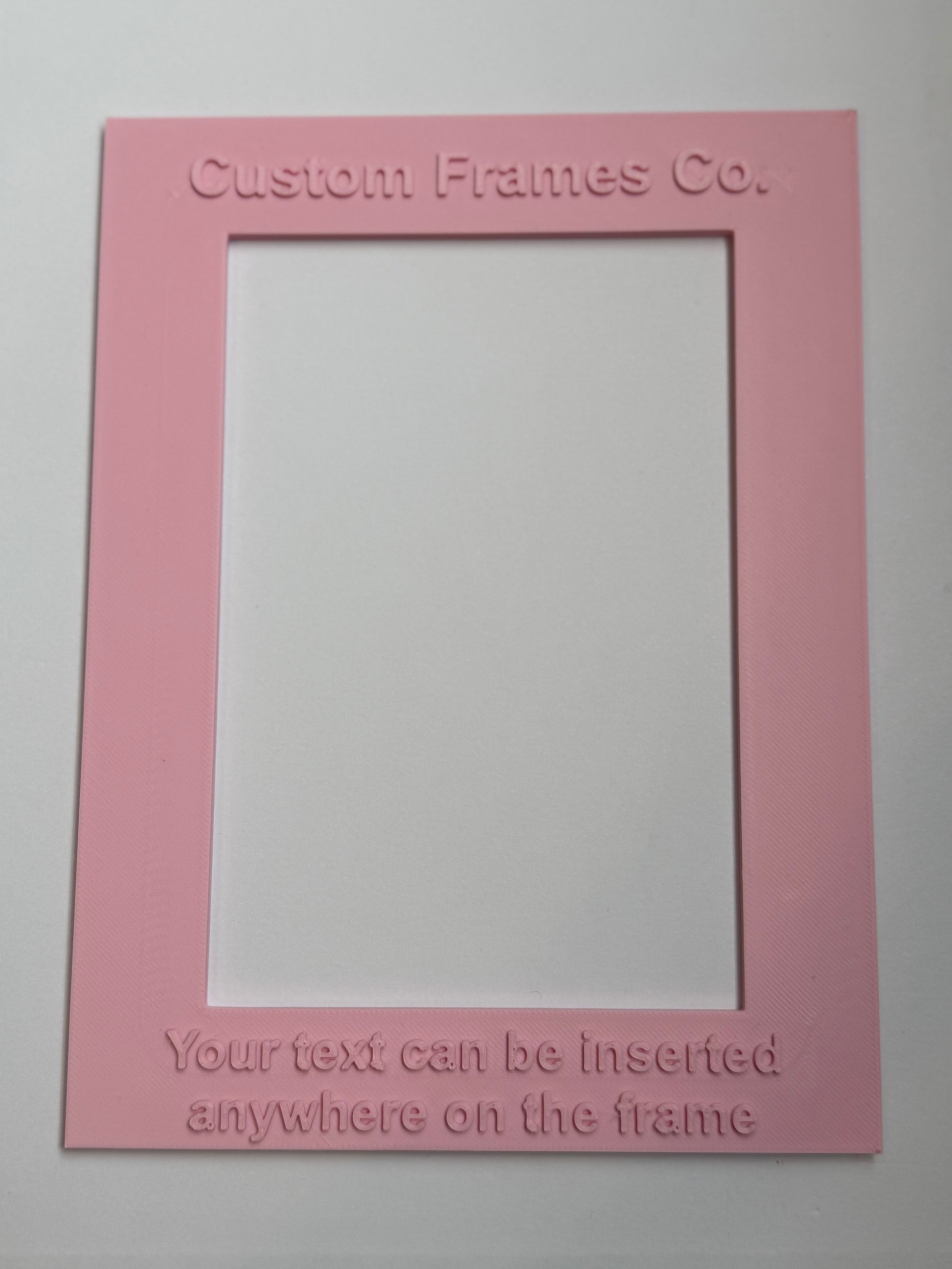 Pink picture frame with text on a white background vetical